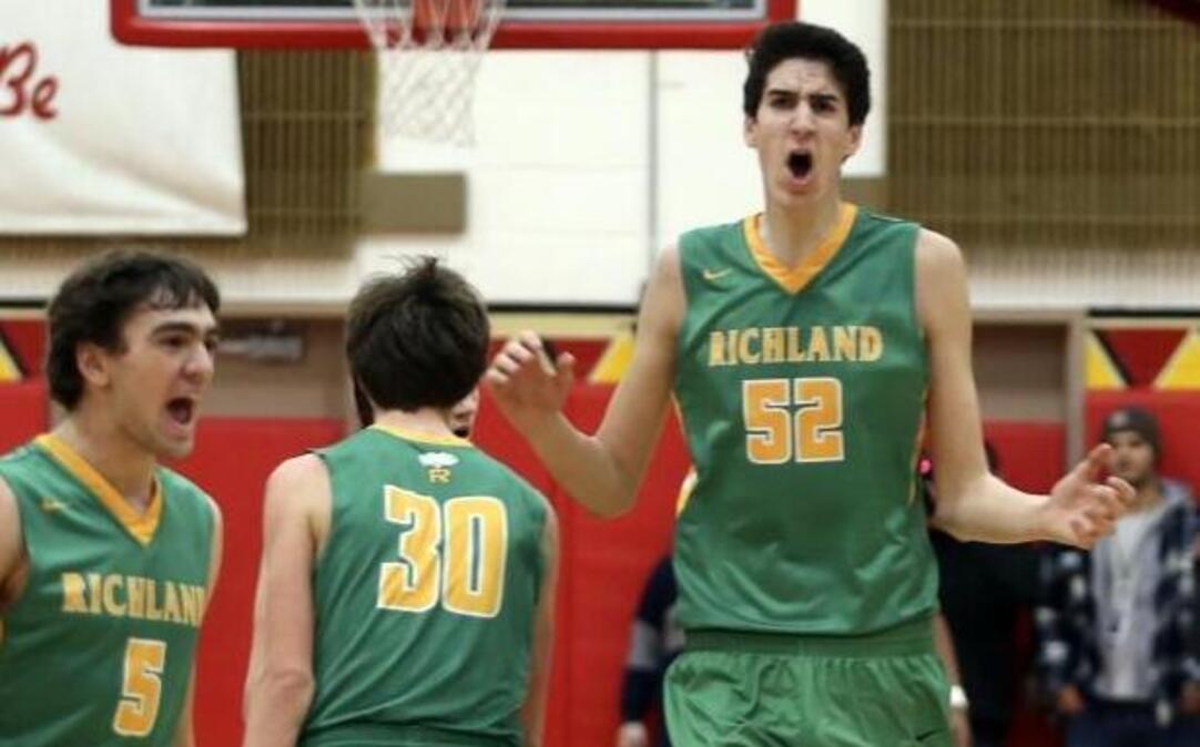 Richland’s 7-foot-3 forward Riley Sorn (52) celebrates with 6-foot-3 teammate Ryan Wagar (5) in the foreground during the Bombers’ win over Kamiakin on Feb. 3.