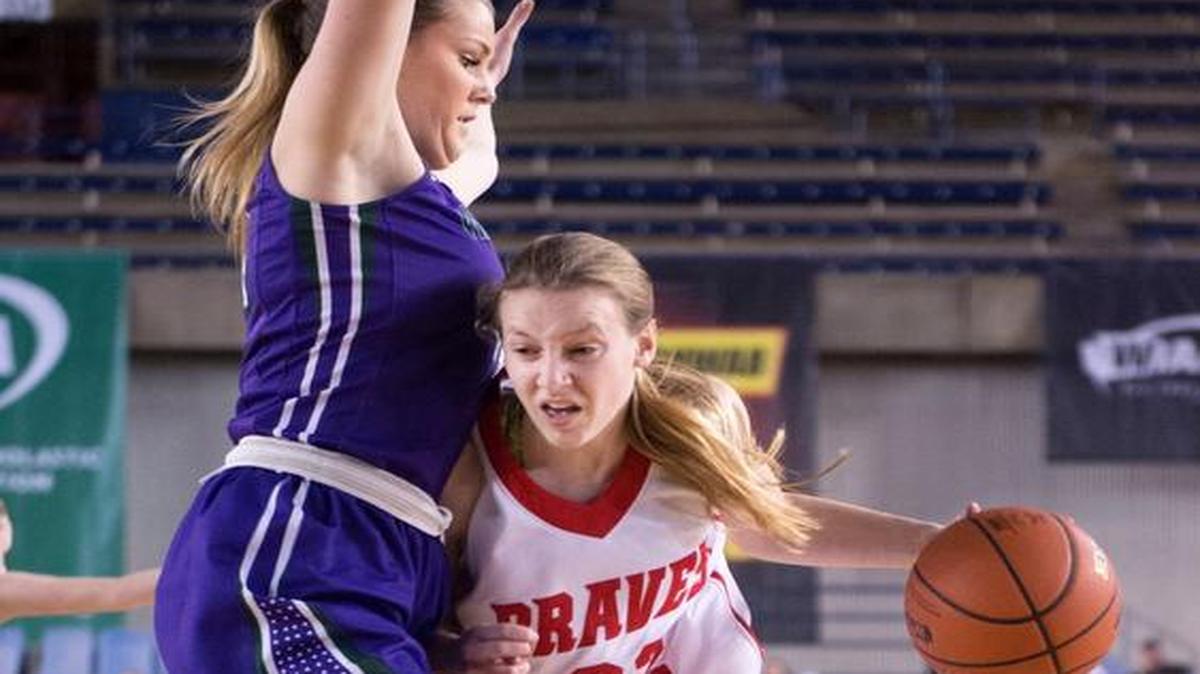 Kamiakin’s Alexa Hazel drives on Missy Peterson of Edmonds-Woodway during Thursday’s Class 3A state quarterfinal game in Tacoma. On Friday, Kamiakin lost to Arlington 44-30 and will play for third place against Lynnwood on Saturday.