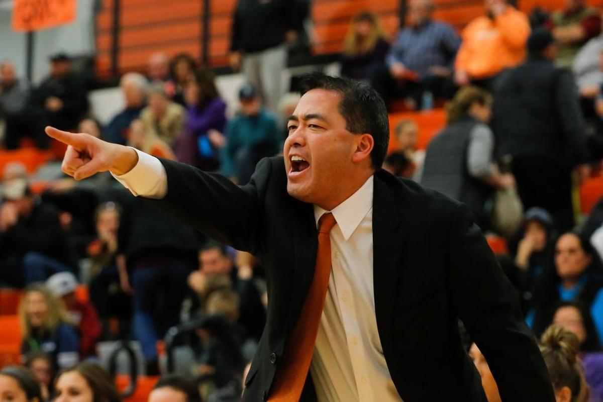 Kennewick girls basketball coach Daron Santo yells out to his players during a game against Eisenhower on Friday. Kennewick won 79-45 for its first win under Santo.