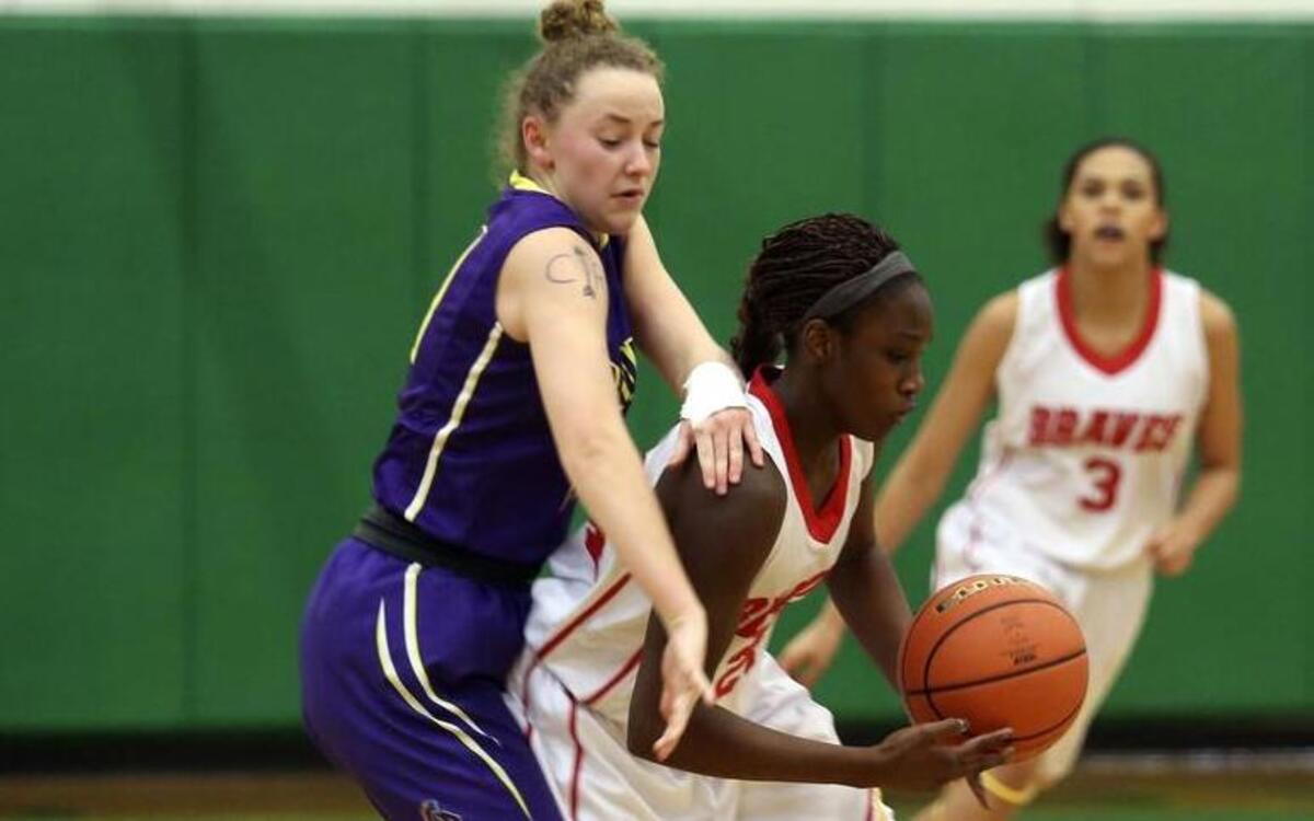 Kamiakin’s Oumou Toure (24) steals a ball from Columbia River’s Kate Kraft during Saturday’s Class 3A state regional game at Richland High School.