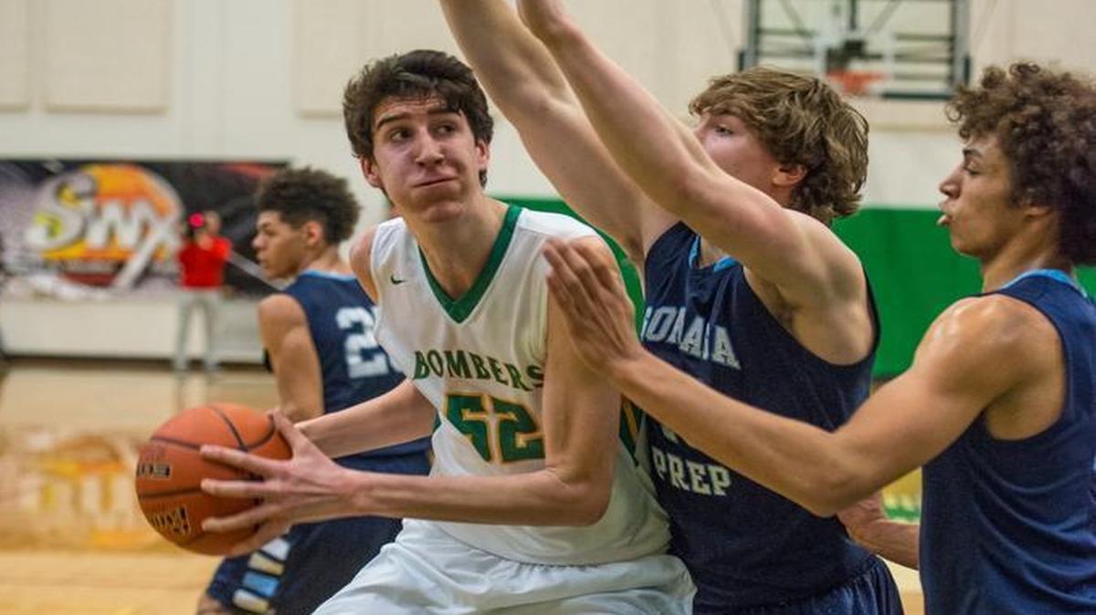 7'3" junior Riley Sorn of Richland is double-teamed by Gonzaga Prep players Shane Eugenio and Anton Watson.
