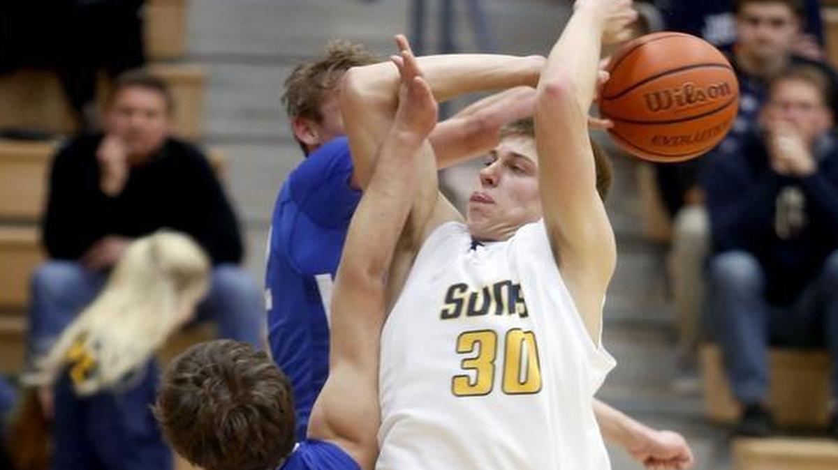 Southridge’s Chad Crider (30) has a shot blocked by Walla Walla’s Jordan Olivares (22) and Andrew Harvey during Tuesday’s Mid-Columbia Conference game at Southridge High School.