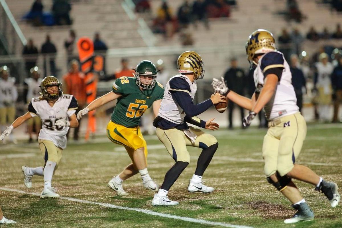 Richland’s Jacob Stanfield (52) pursues Mead quarterback Ryan Chan (12) during their game last week at Edgar Brown Memorial Stadium. Pass rush will be critical for the Bombers again this week as they take on the high-flying West Valley Rams’ offense.