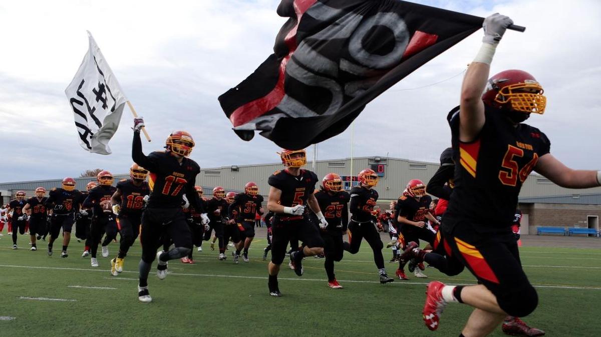 Kamiakin, running onto the field at Lampson Stadium before a 2016 state playoff game against Bonney Lake, beat Eastmont 35-6 on Friday in East Wentachee to open its state title defense season.