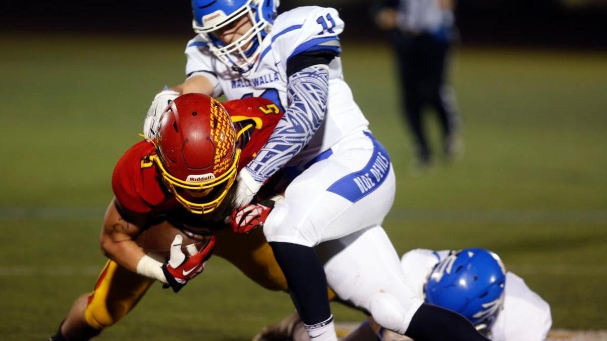 Walla Walla’s Brennan Barberich, now graduated, tackles a Kamiakin player during their 2016 matchup at Lampson Stadium. The Blue Devils are looking to improve on defense this season after allowing a league-high 418.9 yards per game last season.