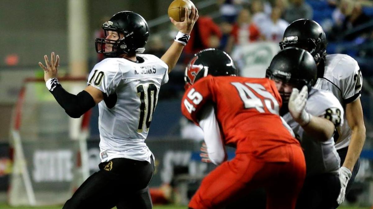 Royal quarterback Kaden Jenks (10) passes during the first half of the Class 1A state football championship game against King’s on Saturday in Tacoma.