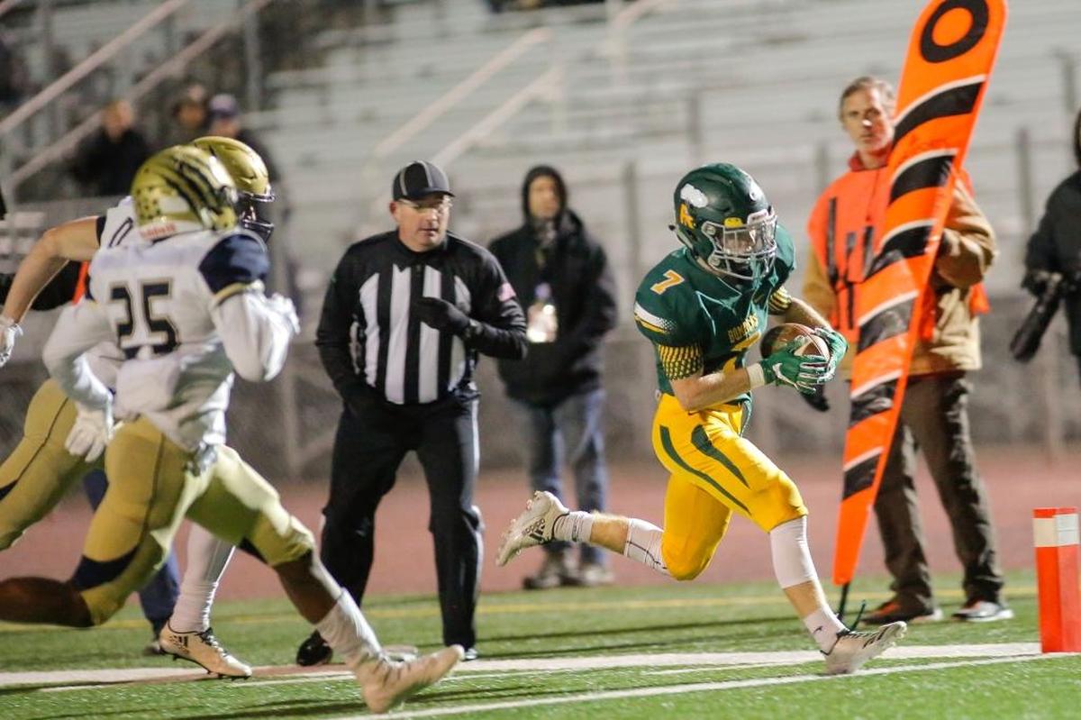 Richland’s Adam Weissenfels (7) runs in a receiving touchdown during the Bombers 62-7 win over Mead on Friday to reach the state playoffs. Weissenfels was one of five Bombers to catch a TD pass from Jensen in the game.