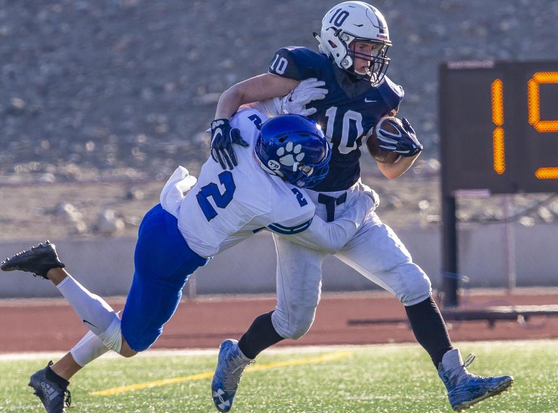 Bothell’s Darius Kubalanza (2) tackles Chiawana’s Gabe Schilz (10) as he runs with the ball during a high school football playoff game at Edgar Brown Stadium in Pasco on Saturday, Nov. 11.