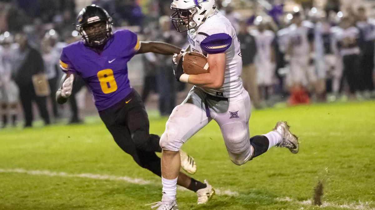 Hanford’s Kamari Durmas attempts to catch Hermiston’s Wyatt Nolan as Nolan runs with the ball during a Mid-Columbia Conference game Friday at Fran Rish Stadium in Richland.