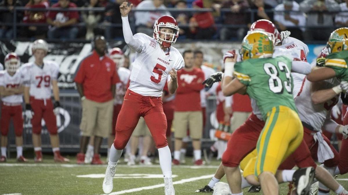 Prosser quarterback Tanner Bolt fires a pass during the 2A football state championship game against Tumwater. He was voted the state Class 2A player of the year by the Associated Press.