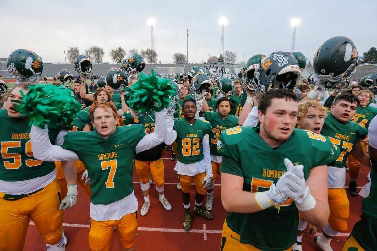 Richland seniors Adam Weissenfels (7) and Jax Lee (52) pump up the crowd after the Bombers beat Central Valley 42-10 in a 4A state semifinal game Nov. 25 at Edgar Brown Stadium.