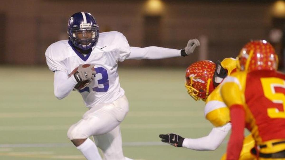 Pasco running back Leon Wright-Jackson looks for an opening during a 2003 game against Kamiakin High School. Wright-Jackson was hired Wednesday as the football coach at Pasco High School.