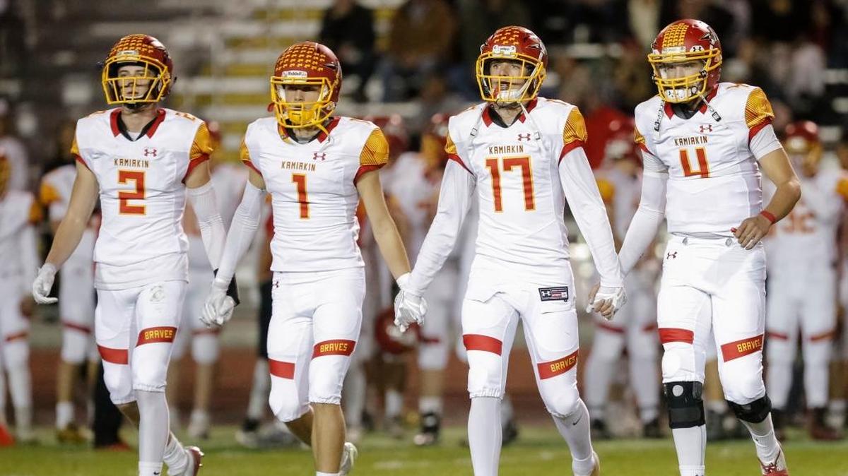Kamiakin captains Colten Chelin (2), Benson Smith (1), Champ Grayson (17) and Payton Flynn (4) walk out for the coin toss before playing Richland on Oct. 6 at Fran Rish Stadium. The Braves were shutout by the Bombers 33-0, and will look to rebound this week against the Kennewick Lions.
