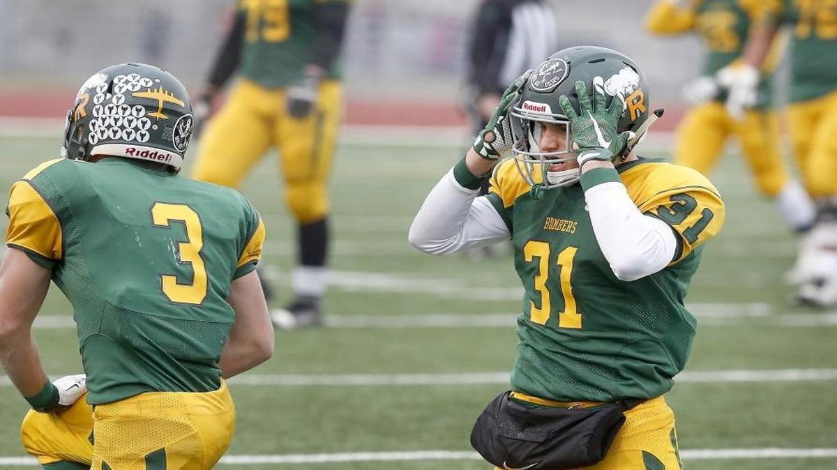 Richland receiver Rhett Levin (31) reacts after a collision with teammate Griffey March (3) that led to a missed reception on a fourth-down attempt late in Saturday’s Class 4A state semifinal against Gonzaga Prep at Edgar Brown Stadium in Pasco.