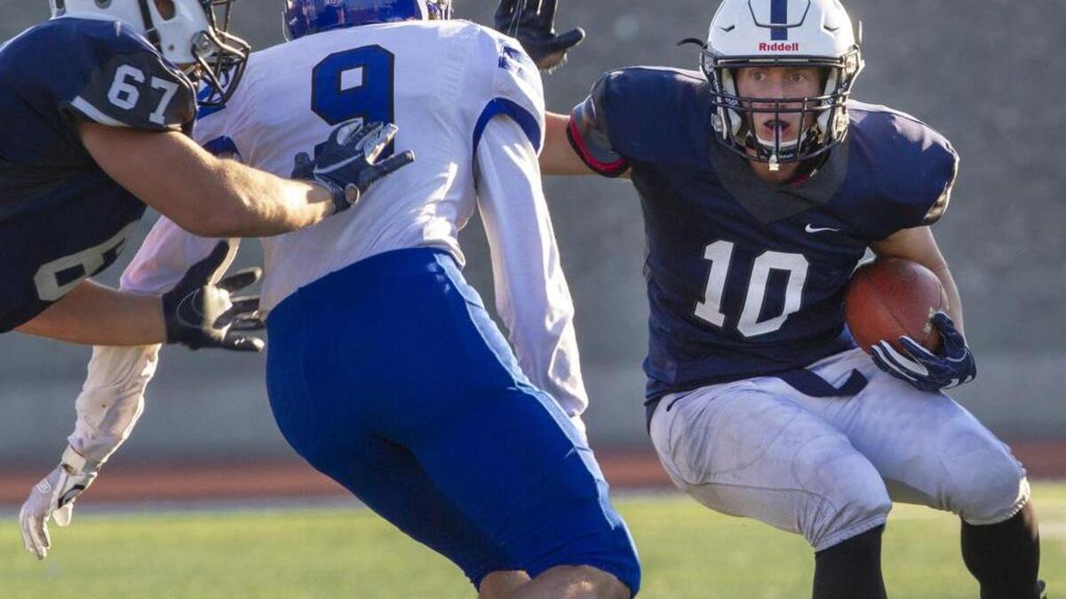 Chiawana running back Gabe Schilz (10) looks for some running room with the help of a block from Hunter Williams on Bothell’s Bryce MacDonald (9) during Saturdday’s 4A playoff game at Edgar Brown Stadium in Pasco. Bothell defeated Chiawana 40-14.