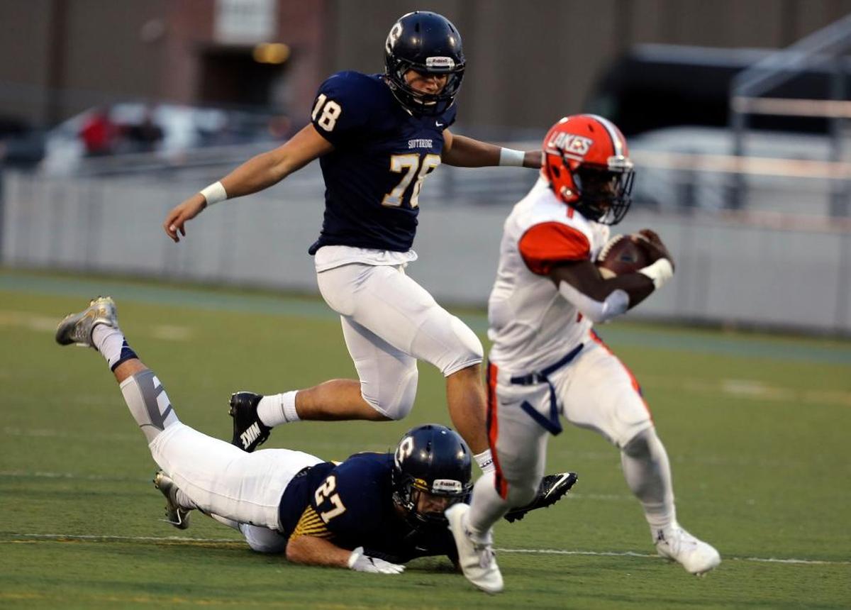 Southridge defensive end Eric Stayrook (78) chases down a Lakes High School players during a state playoff football game last year at Lampson Stadium. Stayrook, a 6-foot-3, 205-pound senior, is the catalyst for the Suns defense this season.