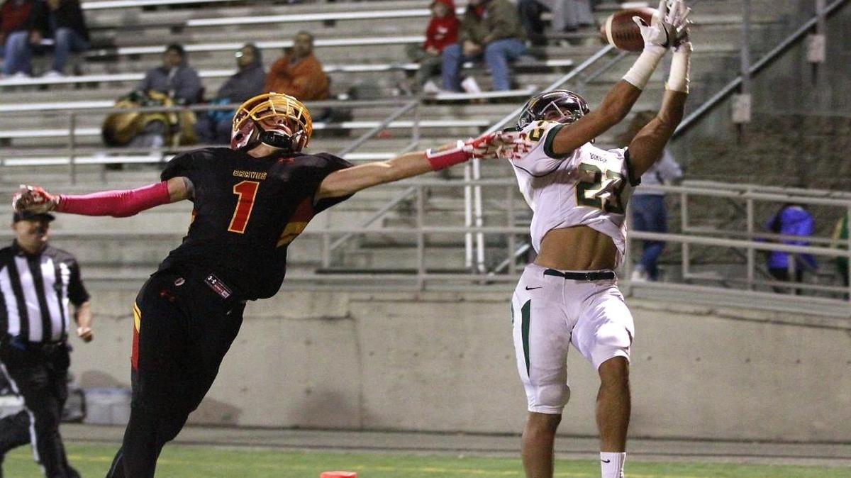 Richland’s Josh Mendoza (23) just misses hauling in a touchdown pass as Kamiakin’s Benson Smith defends the play Friday night at Lampson Stadium in Kennewick.