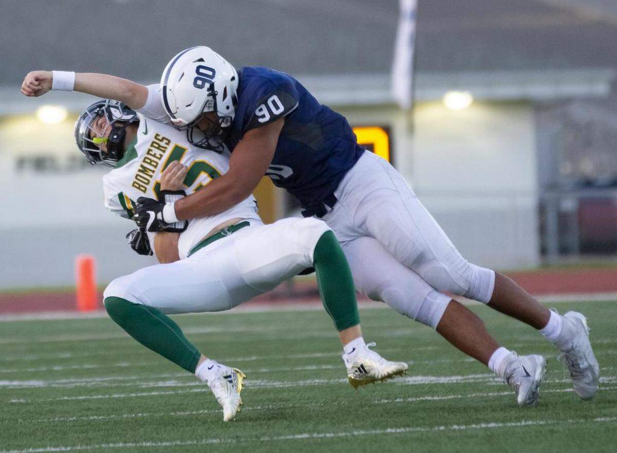 Richland quarterback Josh Fonner gets by Chiawana linebacker AJ Vongphachanh (90) during Friday’s Mid-Columbia Conference game on at Edgar Brown Stadium in Pasco. The pass fell incomplete, but Fonner was knocked from the game.