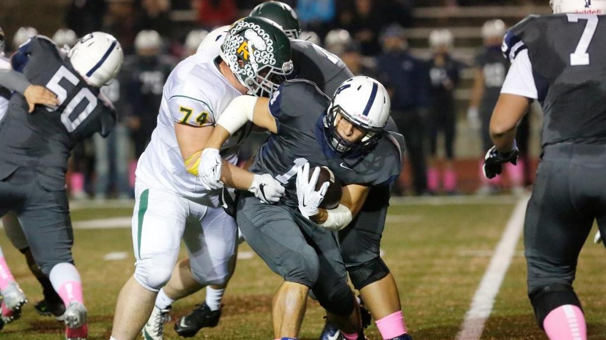 Richland senior defensive tackle Brigham Whitby (74), tackling Chiawana running back Andrew Vargas, missed most of last season because of a broken foot. This year, he has been one of the best players on the Bombers’ roster and in the Mid-Columbia Conference.