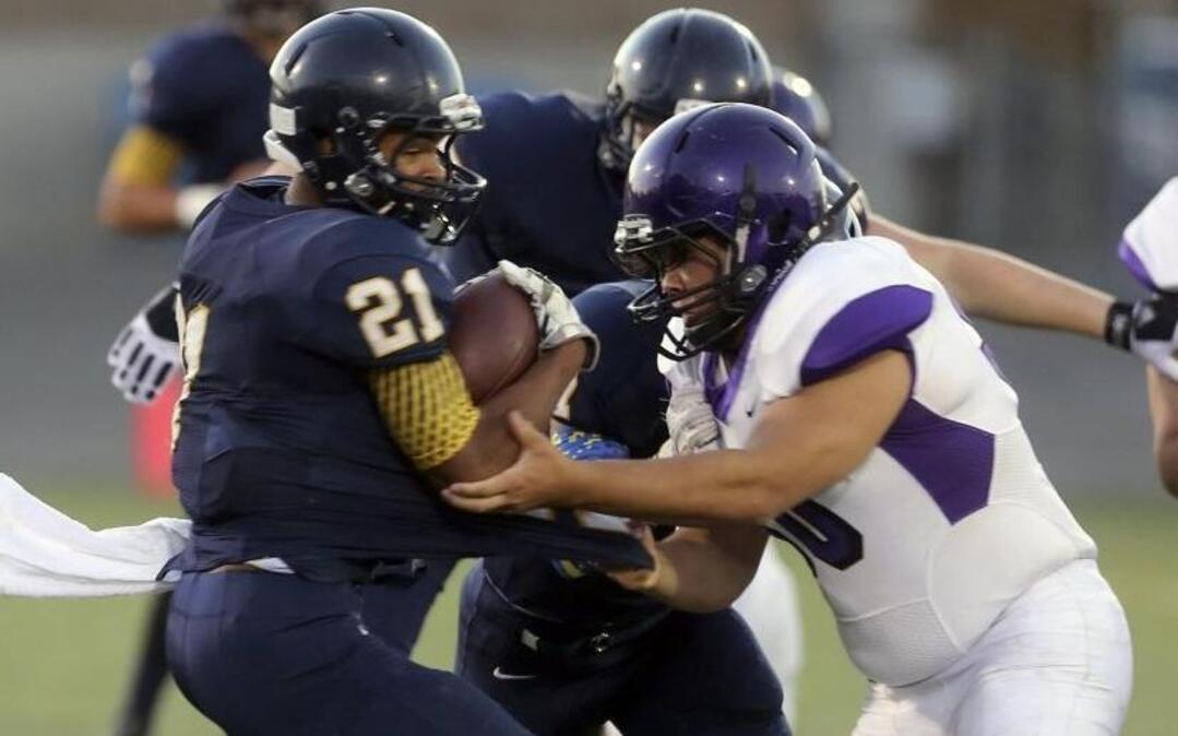 Southridge High School’s Zayid Al-Ghani (21) spins past Pasco defender Francisco Tovar during Thursday night’s game at Neil F. Lampson Stadium in Kennewick.