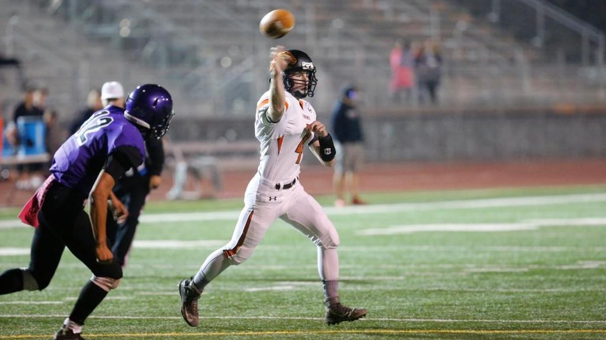 Kennewick’s AJ Templeton throws a pass during a 2016 game against Pasco at Edgar Brown Memorial Stadium. Templeton, the Lions’ quarterback last year as a sophomore, will start at running back this season.