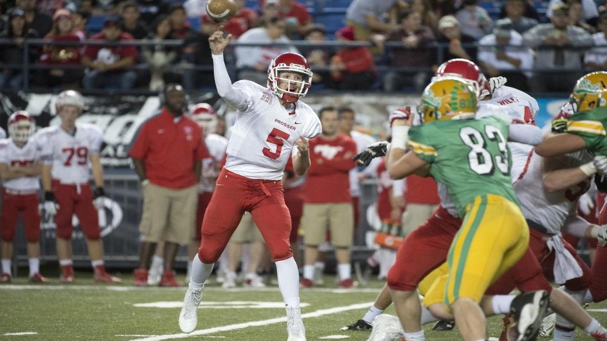 Prosser quarterback Tanner Bolt fires a pass during the Class 2A football state championship game against Tumwater in the Tacoma Dome on Saturday, Dec. 5, 2015. Bolt and the defending state champion Mustangs will take on Othello on Friday in a key CWAC matchup.