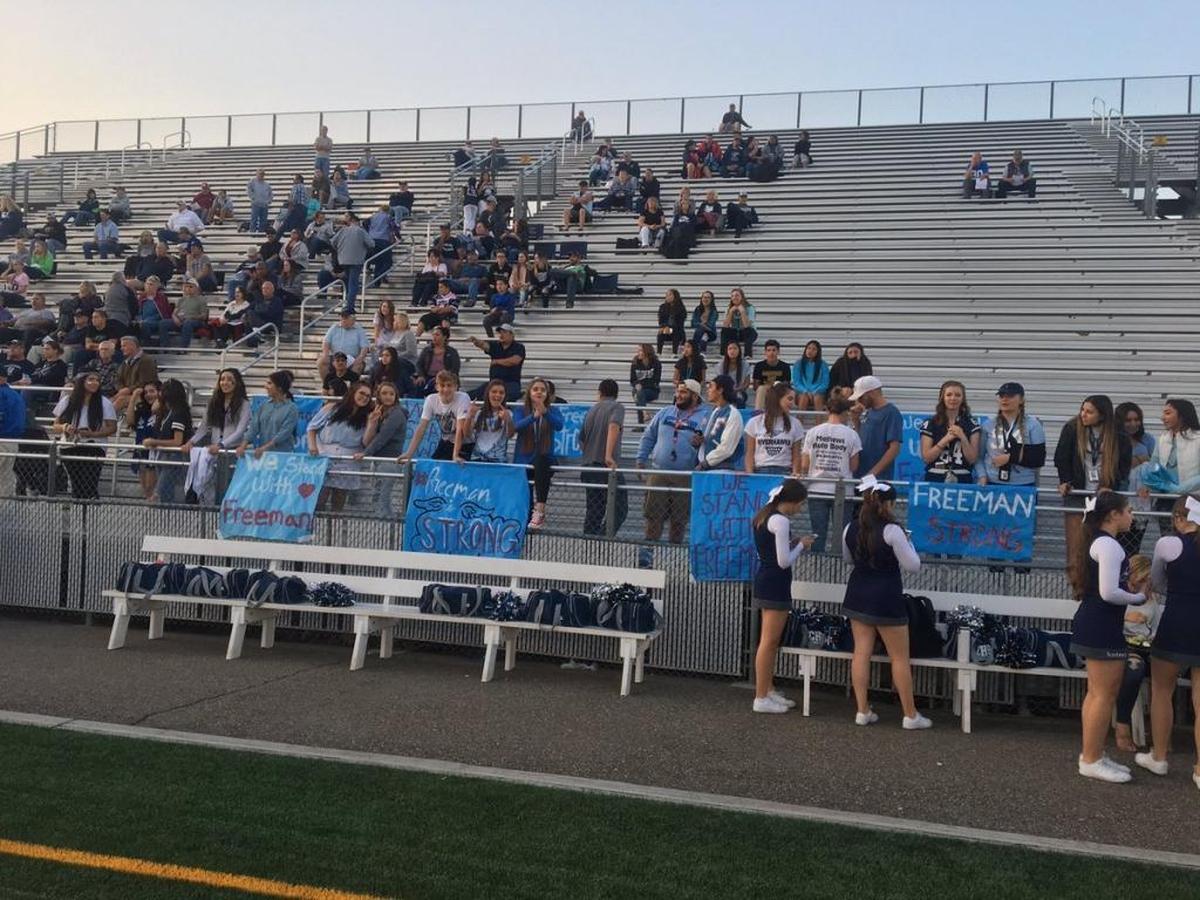 Chiawana’s student section shows its support for Freeman High School after Thursday morning’s shooting with signs and t shirts.