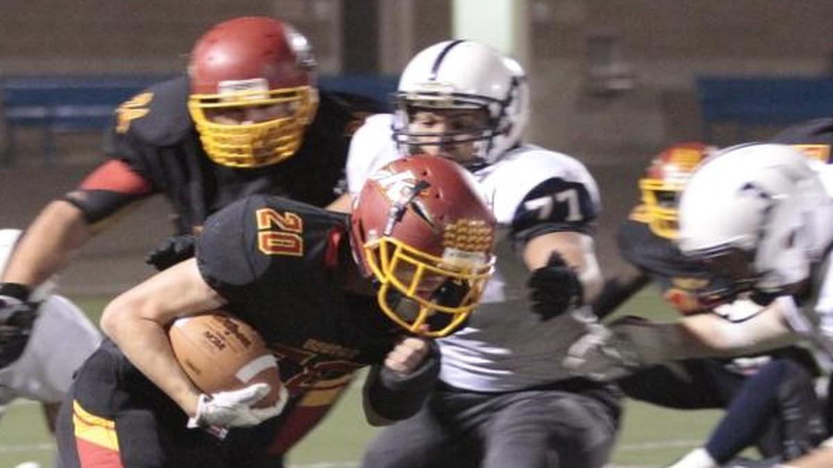 Jethro Questad (20) and the Kamiakin offense hope to put a lot of pressure on Lakes in their Class 3A playoff game Saturday at Lampson Stadium.