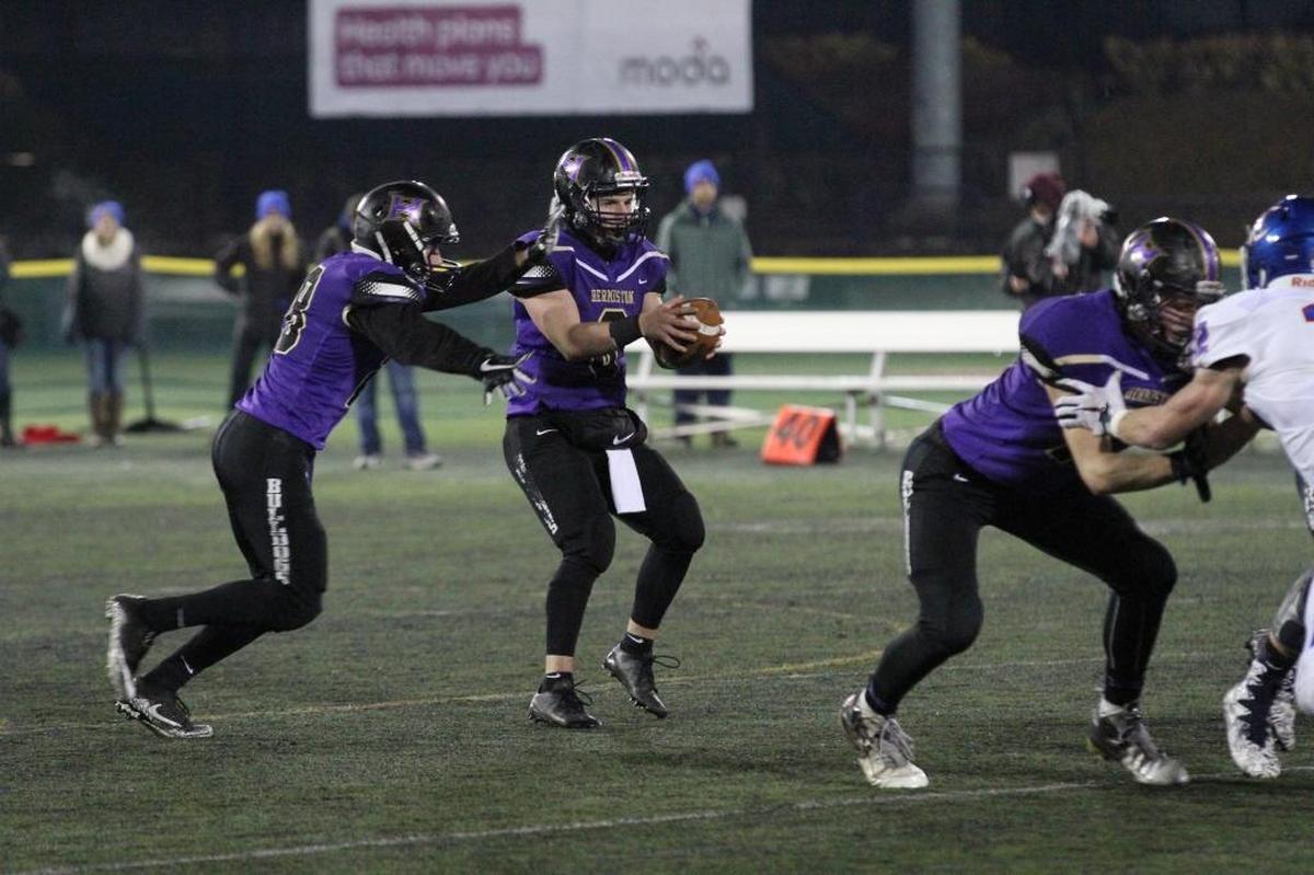 Hermiston quarterback Andrew James, receiving a snap during the Bulldogs’ state championship victory over Churchill on Saturday at Hillsboro Stadium, will again be a team leader next year when he returns for his senior season and the Bulldogs compete in the WIAA and Mid-Columbia Conference.