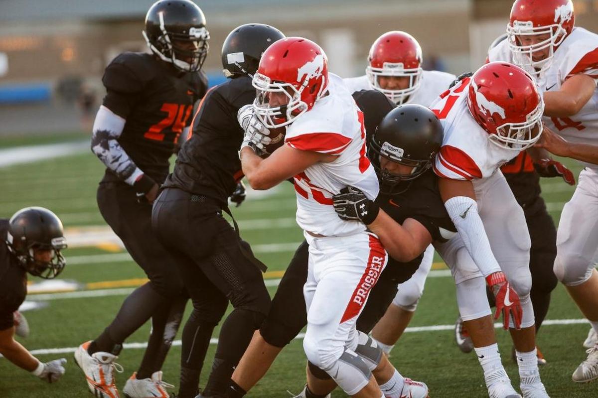 Prosser's running back JR Coleman (25), center, drives the ball in for a touch down during a boys football game against Kennwick on Friday at Neil F. Lampson Stadium.
