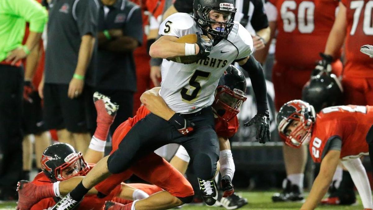 Royal wide receiver Samuel Christensen (5) tries for extra yardage as he is tackled in the first half of the Class 1A high school football championship against King’s on Saturday in Tacoma.