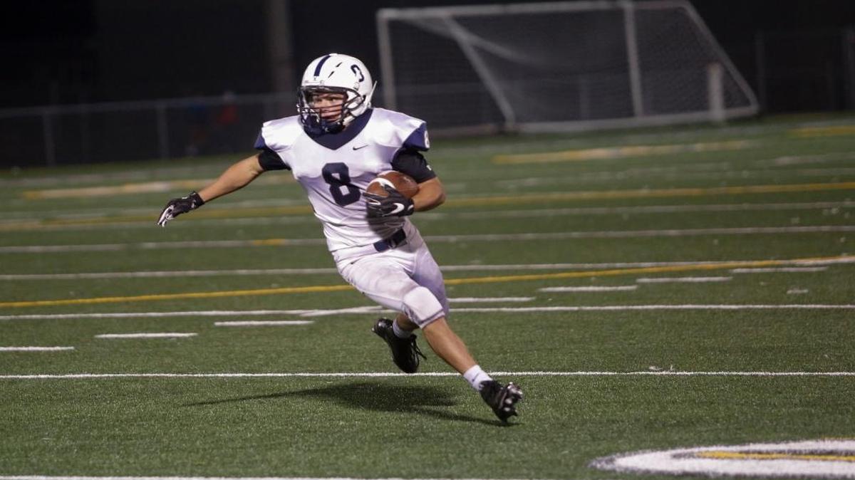 Chiawana’s Riley Cissne runs with the ball after making an interception against Kamiakin, Sept. 15 at Lampson Stadium. The Riverhawks defense was in fine form again Friday, shutting out Southridge to get a 34-0 win.