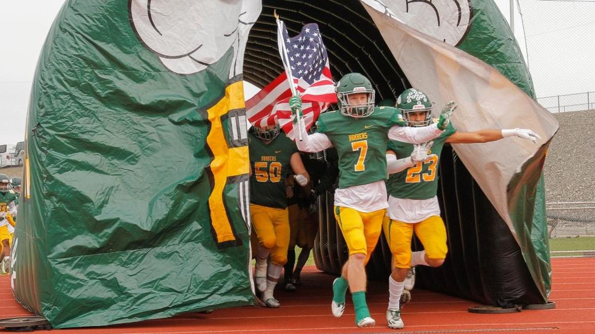 Richland’s Adam Weissenfels (7), leading the Bombers onto the Edgar Brown Stadium field before a 4A state game vs. Central Valley, is the Herald’s All-Area Player of the Year.