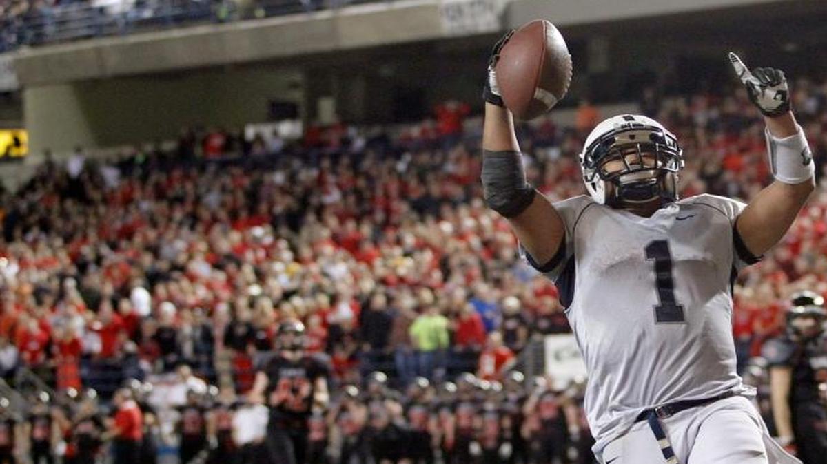 Chiawana’s Clifton Lozano celebrates after scoring on a pass play against Camas during the Class 4A football championship game in 2013 in Tacoma. The WIAA on Monday agreed to a contract to keep the title games in Tacoma through 2018.