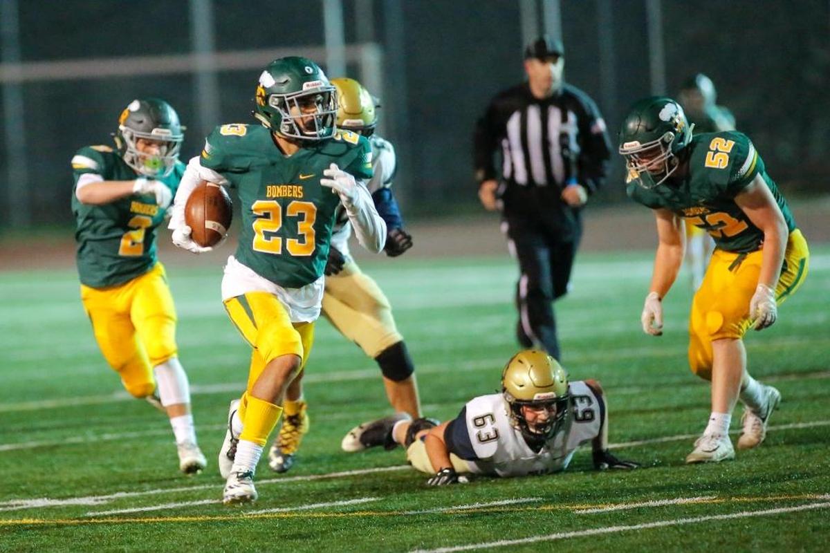 Richland’s Josh Mendoza (23) returns an interception for a touchdown during the first quarter of Richland’s 62-7 win over Mead on Friday at Edgar Brown Stadium in an MCC-GSL 4A crossover game. Mendoza had three interceptions on the night and returned two of them for touchdowns, while also scoring on a 69-yard touchdown reception.
