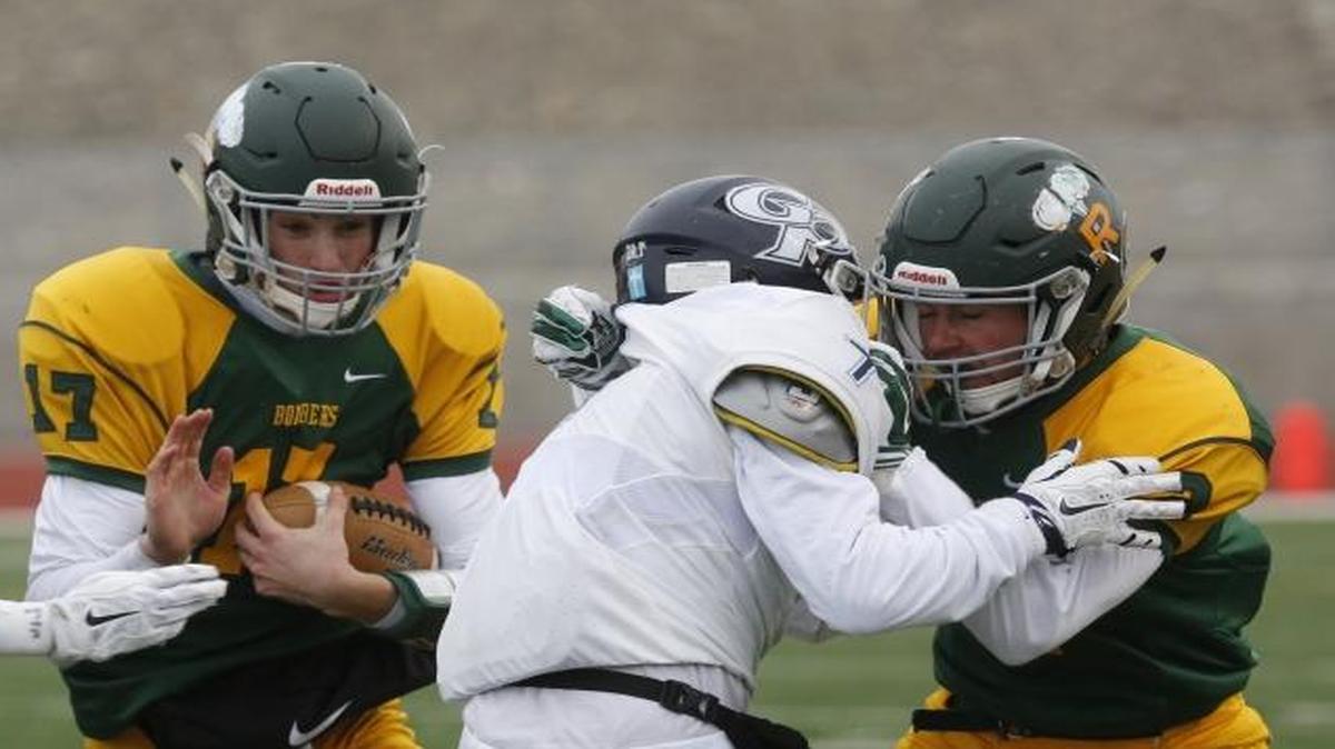Richland High School quarterback Paxton Stevens, attempting to break a tackle against Gonzaga Prep during a 2015 Class 4A state semifinal game at Edgar Brown Stadium in Pasco, will lead the Bombers offense again in his senior season. Stevens threw for nearly 1,800 yards with 13 touchdowns last year and was named the first team All-Mid-Columbia Conference quarterback.