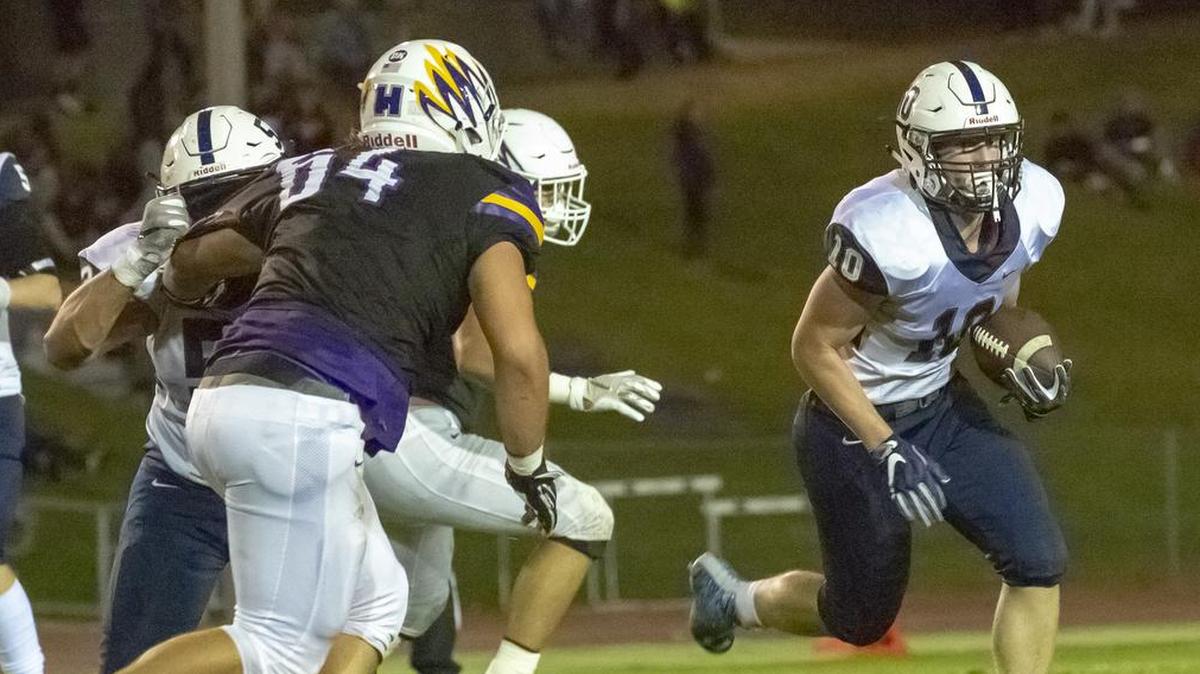 Chiawana’s Gabe Schilz (10) runs against Hanford’s defense during last week’s loss to the Falcons. The defeat threw the Mid-Columbia Conference standings for a loop.