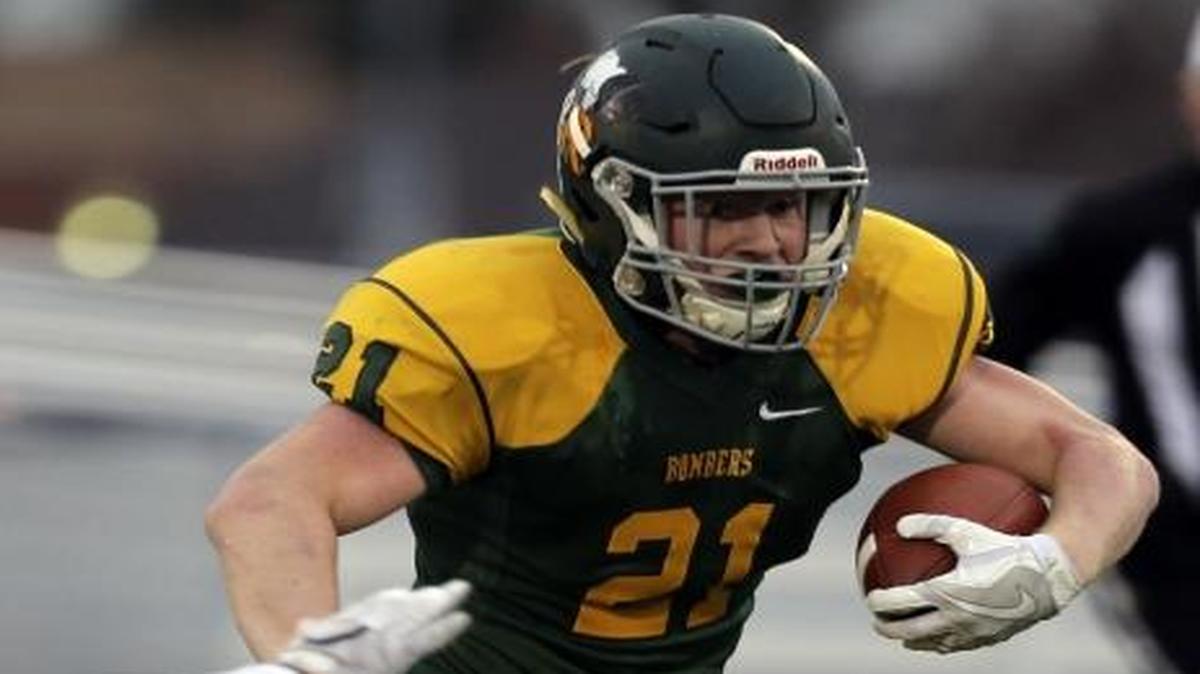 Richland’s Parker McCary (21) slips past Skyview defender Angelo Sarchi (1) thanks to a nice block from Ryan Kriskovich during Saturday’s Class 4A semifinal at Lampson Stadium in Kennewick. McCary ran for a pair of touchdowns. See more photos at www.tricityherald.com.