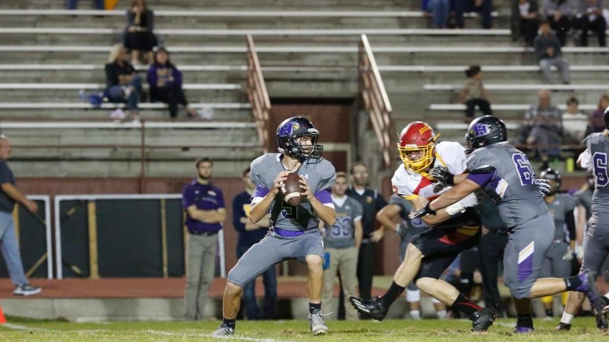 Hanford quarterback Garrett Horner (5) drops back to pass during a 2016 game against the Kamiakin Braves at Fran Rish Stadium. The Falcons went on the road to beat Walla Walla 24-6 on Friday night.