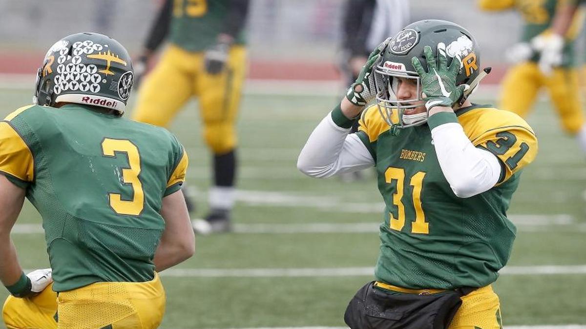 Richland receiver Rhett Levin (31) reacts after colliding with teammate Griffey March (3), which led to a missed reception on fourth down late in the fourth quarter during Saturday’s Class 4A state semifinal game against Gonzaga Prep at Edgar Brown Stadium in Pasco. The Bombers ended up losing the game and ending their season.