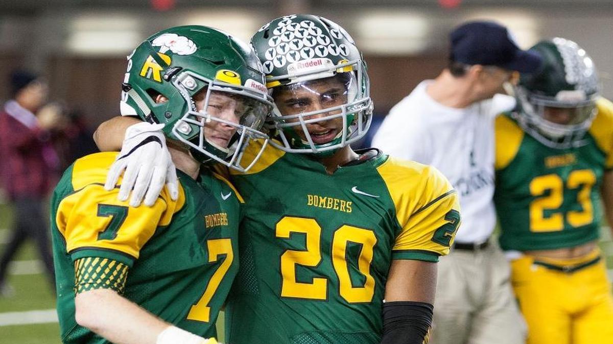 Richland’s Adam Weissenfels, left, and Ryan Piper console each other after Saturday’s 24-14 loss to Camas in the Class 4A state championship game Saturday at the Tacoma Dome.