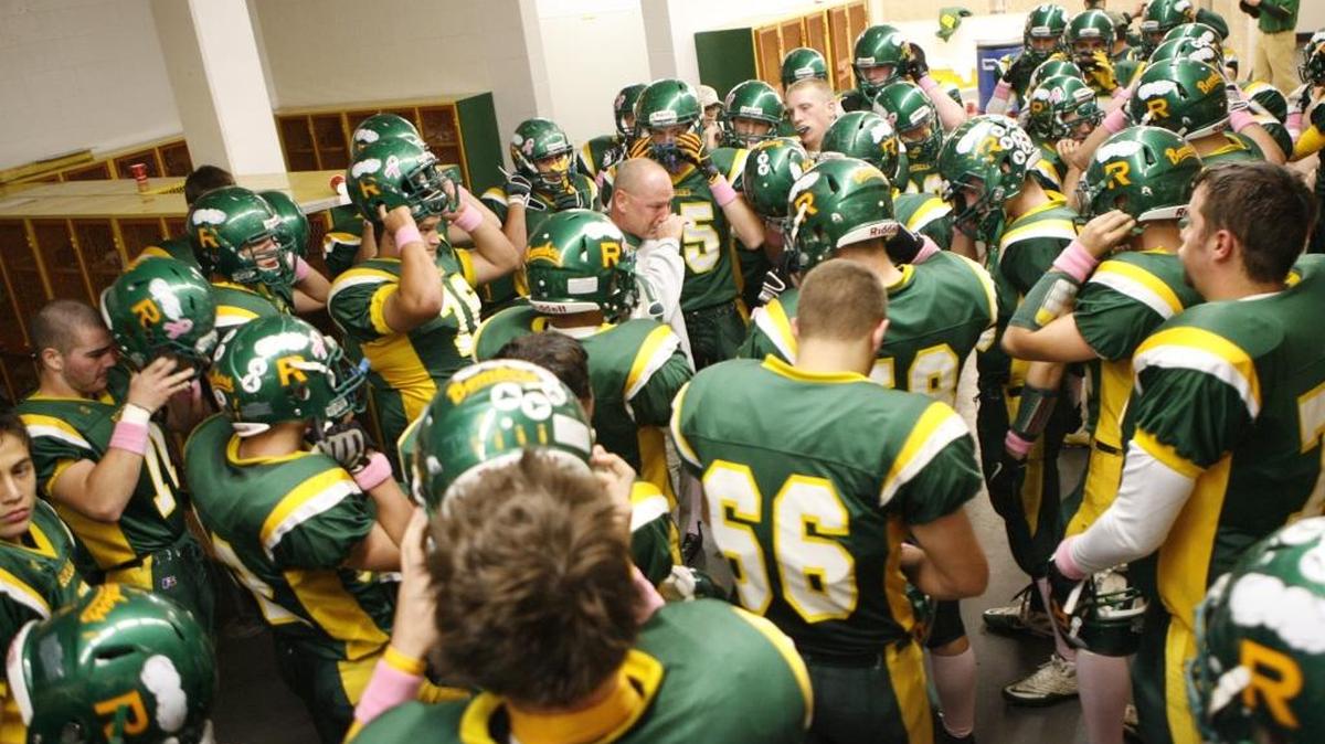 Richland coach Mike Neidhold gets emotional after talking to his team on Senior Night in 2010 before they went on to defeat Walla Walla 34-7 at Fran Rish Stadium in Richland.