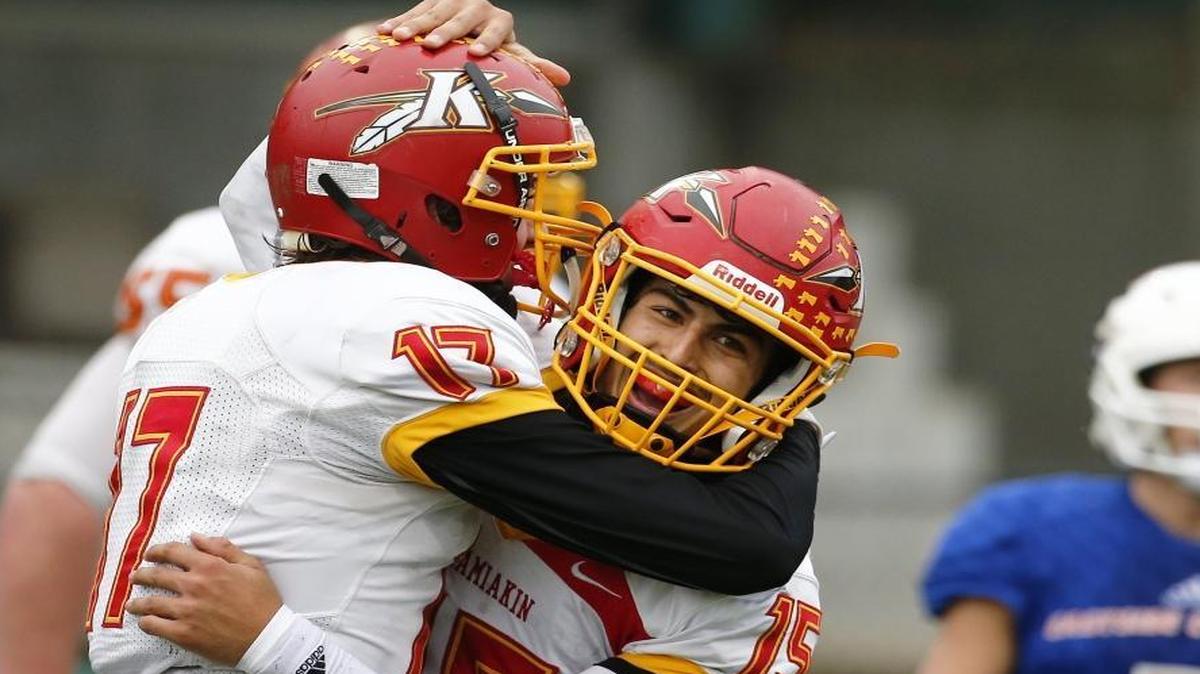 Kamiakin quarterback Zach Borisch, right, celebrates with receiver Champ Grayson after scoring a touchdown in the first half of their Class 3A semifinal game against Eastside Catholic on Saturday at Pop Keeney Stadium in Bothell.