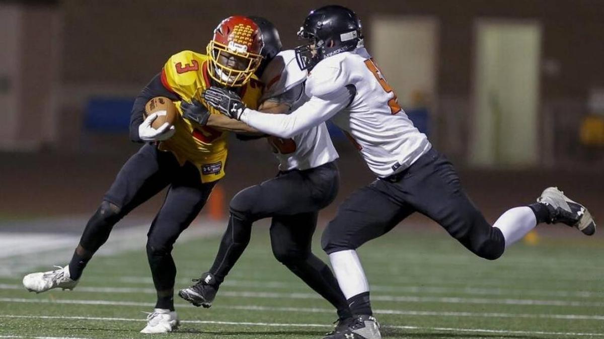 Kamiakin freshman running back Tuna Altahir, trying to break a tackle against Kennewick last week, was the team’s feature tailback for the second straight game Friday night at Walla Walla, as he carried it 26 times for 113 yards. The Braves won the game 33-7.