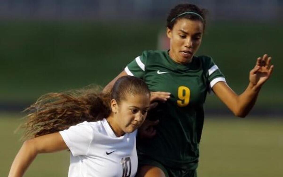 Chiawana High School’s Summer Yates (10) moves past Richland High School’s Jazmine Gray (9) Thursday during a girl’s soccer game at the school in Pasco.