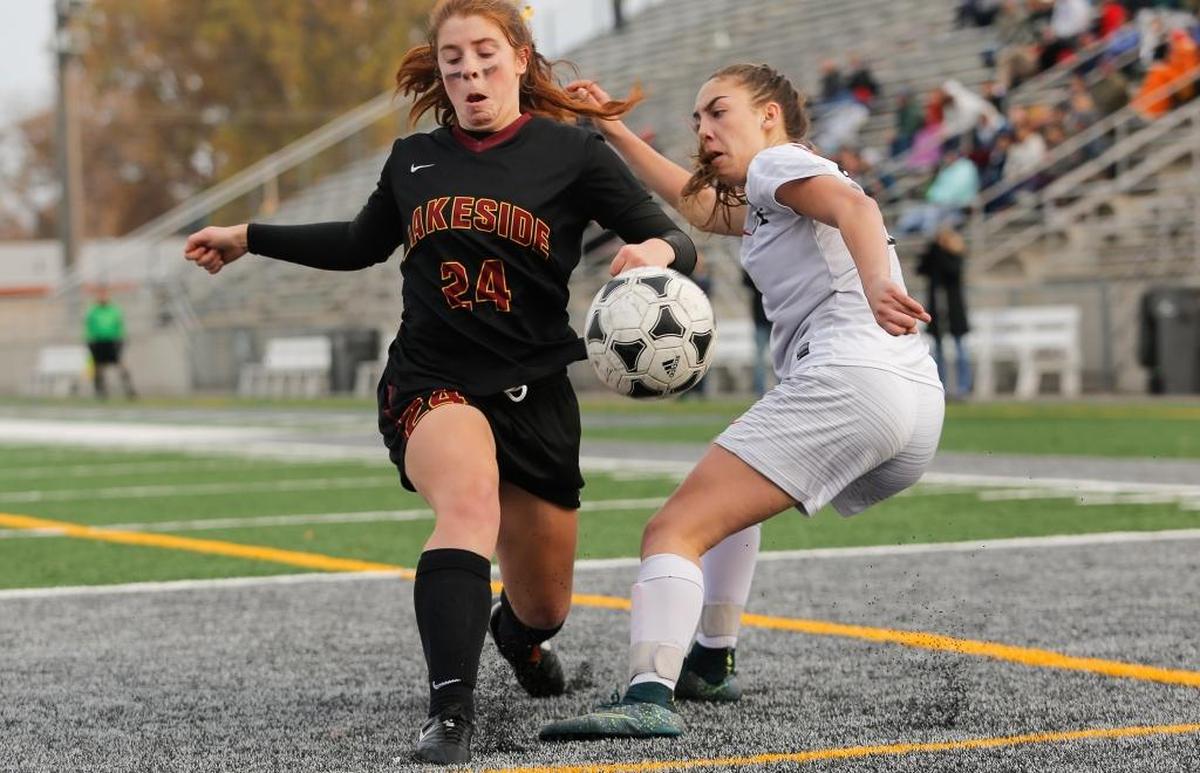 Lakeside's Mia Voce (24) and Kamiakin's Mikayla Hunter (21) battle for the ball during a Class 3A girls soccer state quarterfinal game on Saturday at Lampson Stadium. Kamiakin won 2-1.