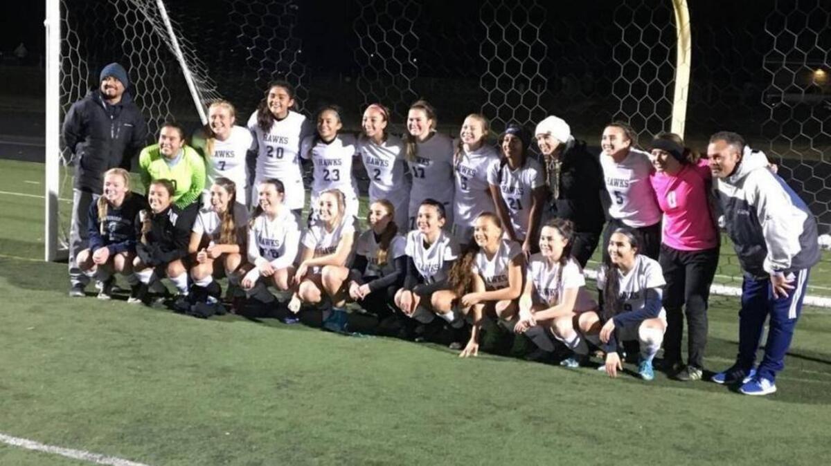 The Chiawana girls soccer team poses for a photo after beating Lewis and Clark 4-0 on Saturday at home to earn its third consecutive Class 4A state playoff berth.