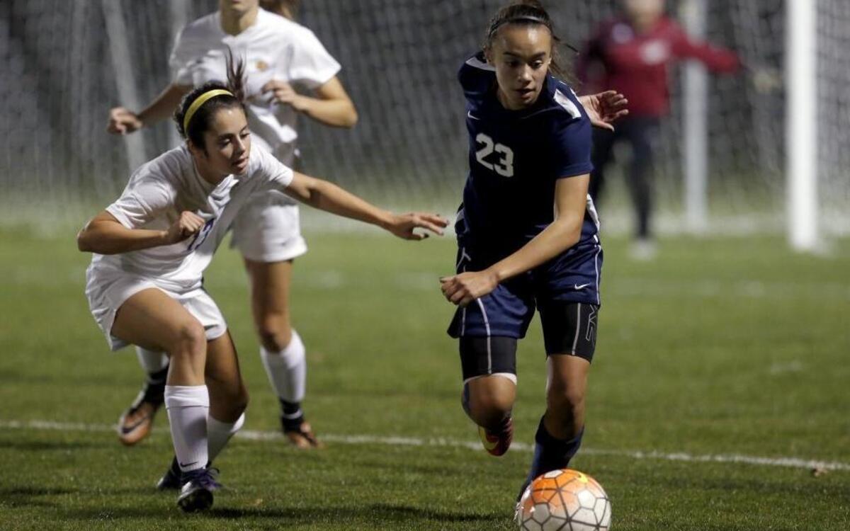 Hanford’s Jessica Maher, left, and Chiawana’s Macey Morales (23) go after a ball during Thursday’s Class 4A regional soccer championship at Hanford High School. See more photos at www.tricityherald.com.