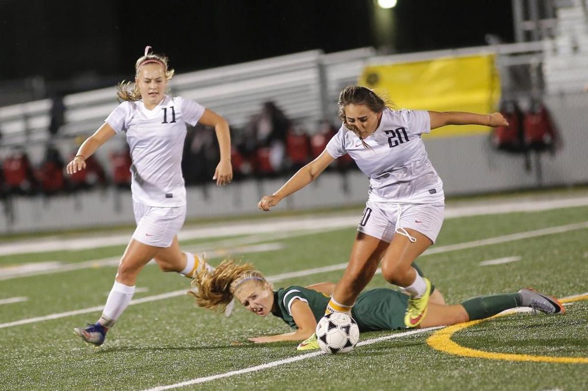 Kamiakin's Kaylee Kraft (11) looks on as Kahlea Sullivan (20) takes the ball from Richland's Gabrielle Fillmore (24) during a Mid-Columbia Conference girls soccer game at Lampson Stadium in Kennewick earlier this season.