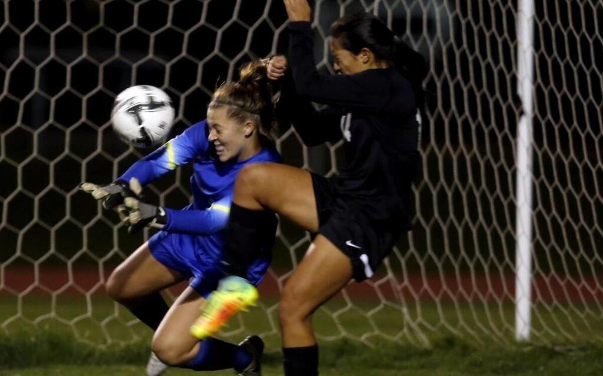 Hanford High School's Kelsee Winston (0) and Fany Cossio (14) block a goal attempt from Southridge High School's Syd Sanders Tuesday during a game at the school in Kennewick.